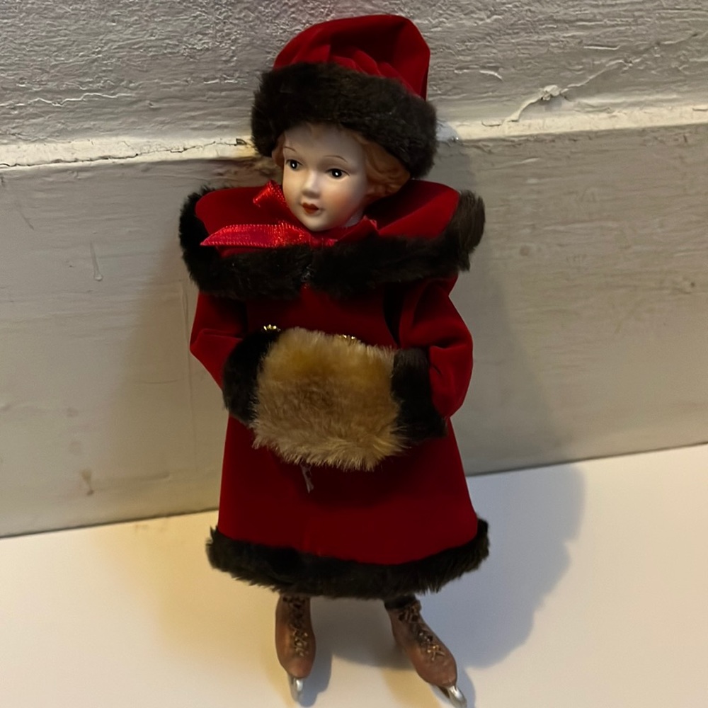 Ice Skating china girl in vintage  coat with muff
